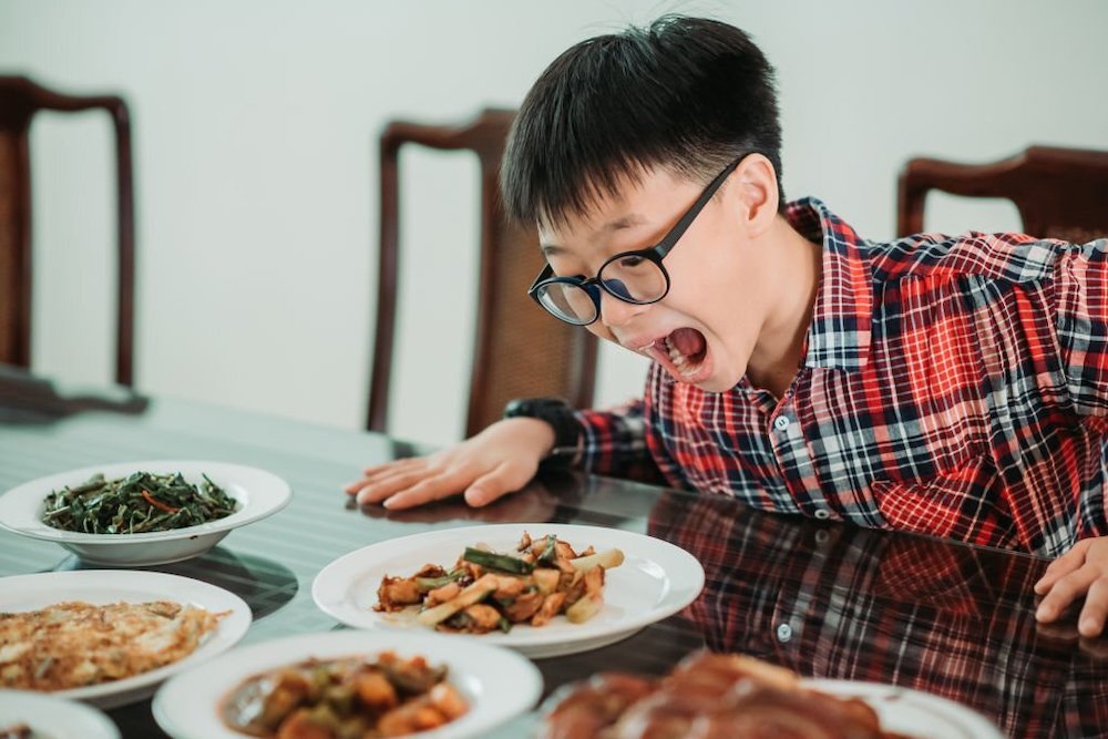 Asian boy eating